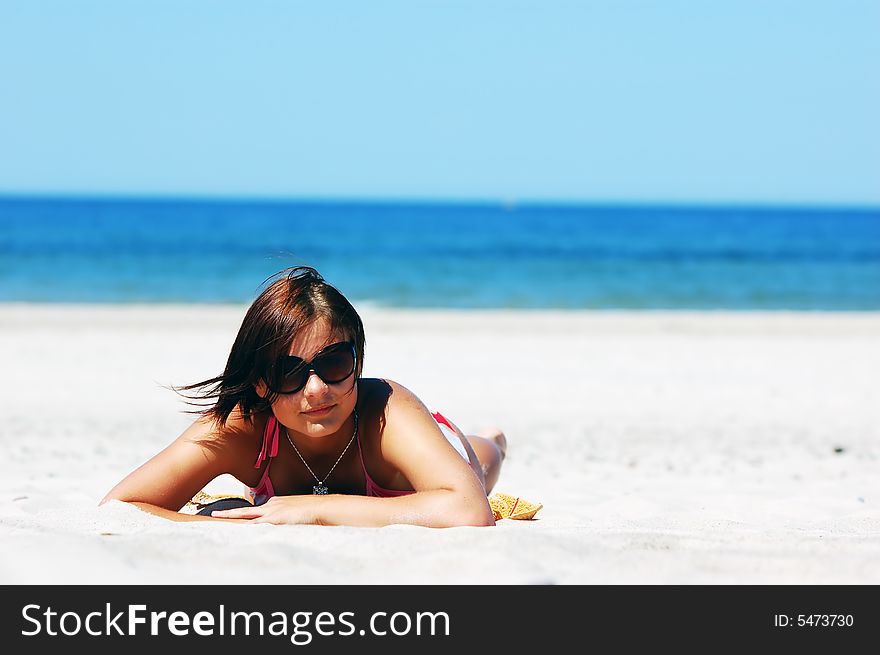 Beautiful woman relaxing on the beach. Beautiful woman relaxing on the beach