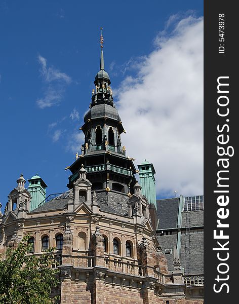 An old church from the 18th century with intricate details and oxidation on the metal parts of the steeple.