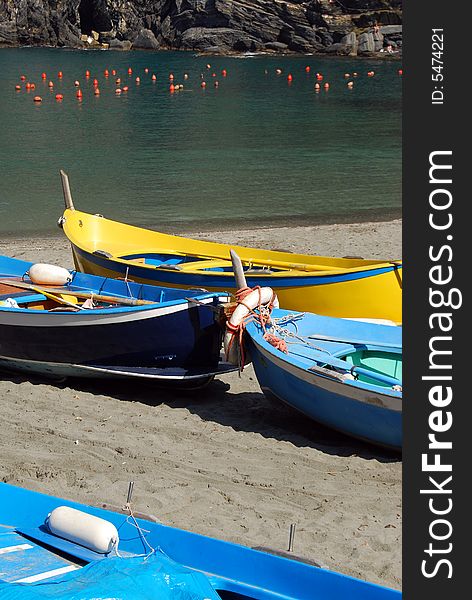 Coloured boats on a beach