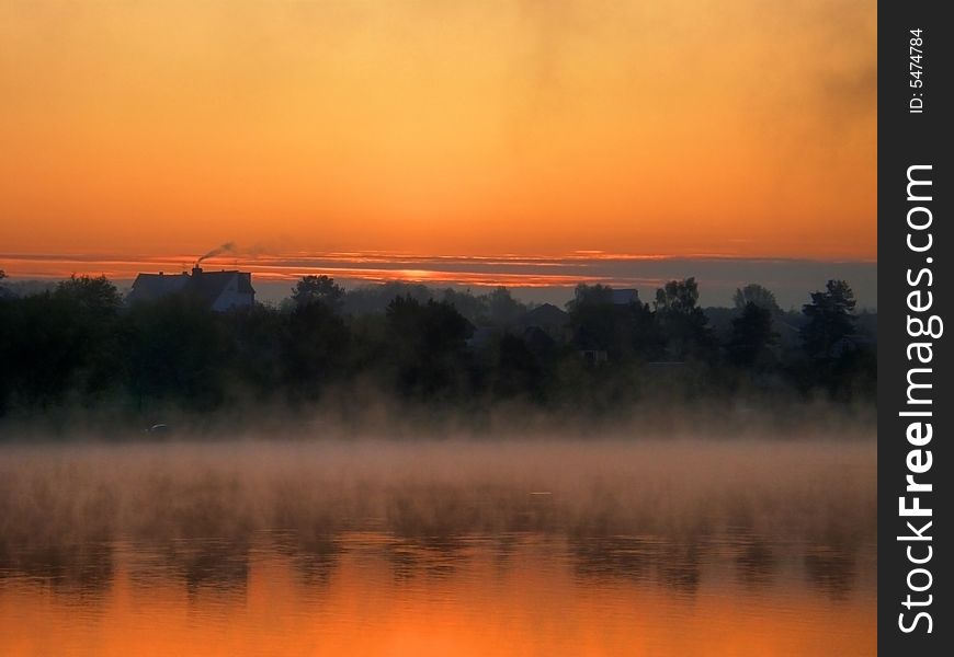 Misty morning on a lake with wonderful dawn. Misty morning on a lake with wonderful dawn