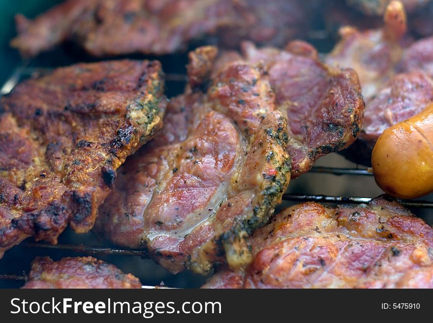 Cooking meat on the grill outdoor