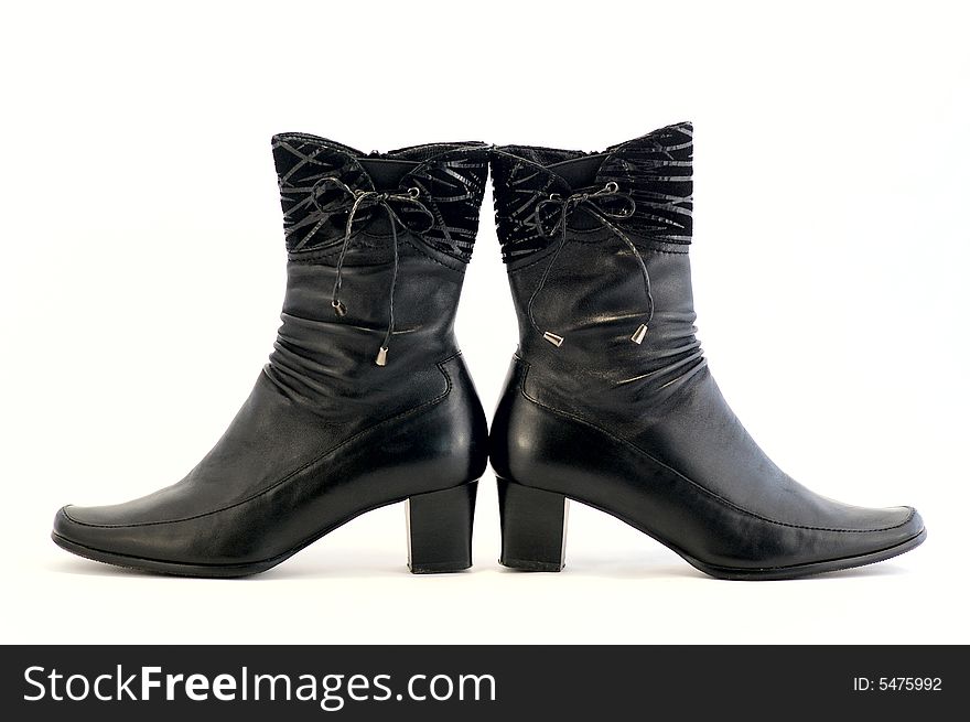 Pair of leather women's boots against the white background. Pair of leather women's boots against the white background