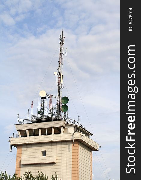 The tower in the airport with telecom equipment. The tower in the airport with telecom equipment