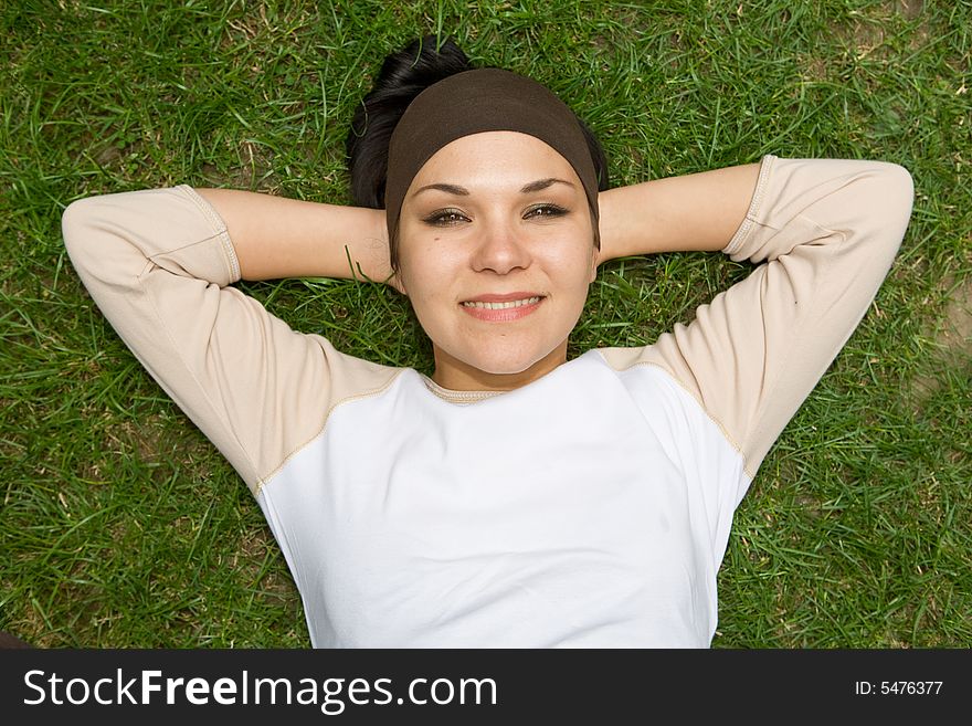 Attractive woman on green grass. Attractive woman on green grass