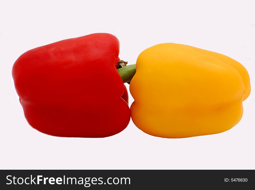 Red and yellow peppers isolated on the white background