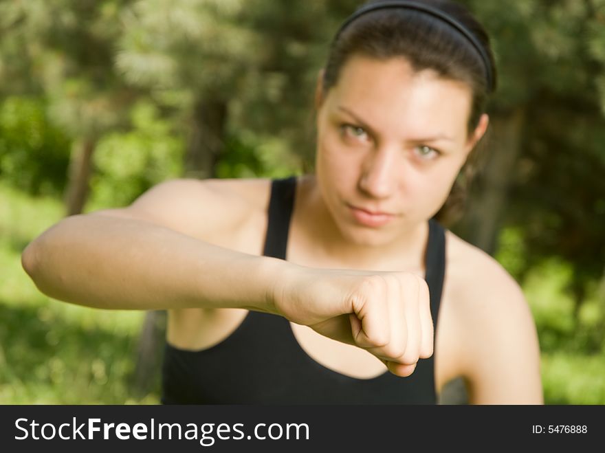 Close-up of fist of young sporty girl, shallow DOF, focus is on the fist