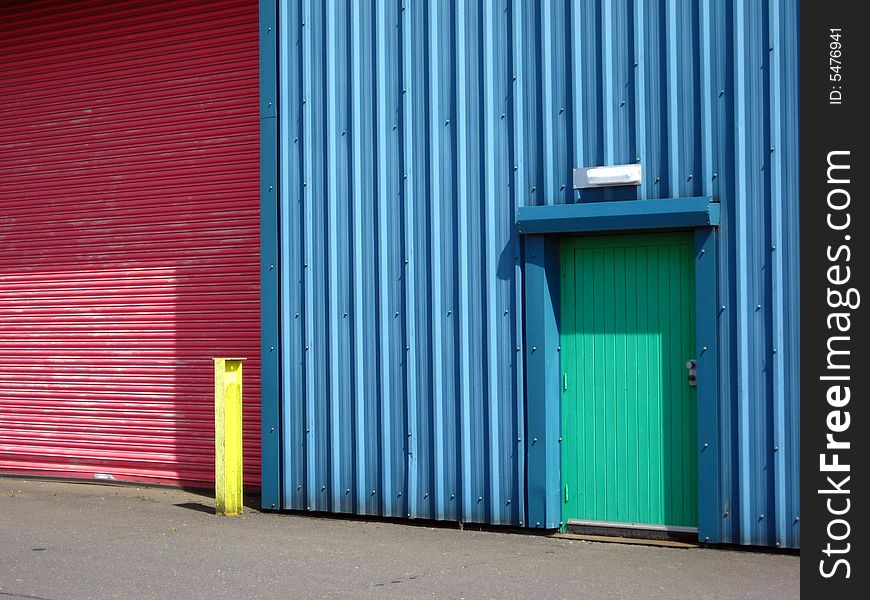 Colourful factory wall doors and post in vivid color. Colourful factory wall doors and post in vivid color