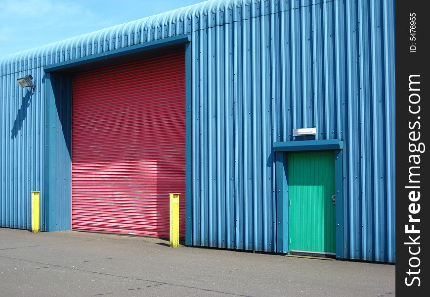 Colourful factory with bright wall, doors and posts. Colourful factory with bright wall, doors and posts