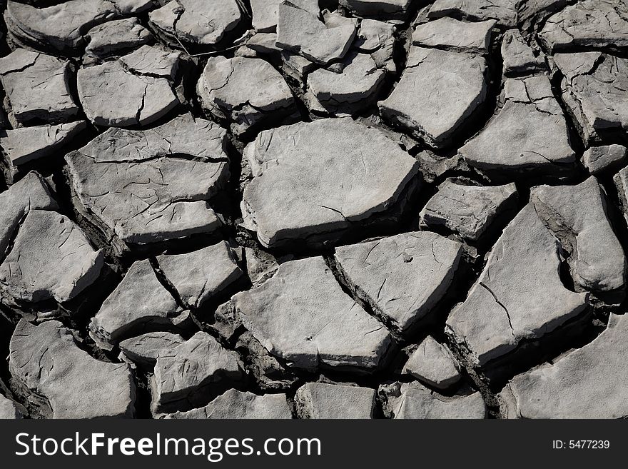 Parched and cracking mud in heat of the sun during drought. Parched and cracking mud in heat of the sun during drought