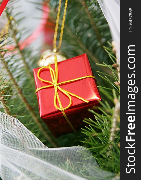 Little Red Gift Box hanging on a Christmas Tree. Little Red Gift Box hanging on a Christmas Tree