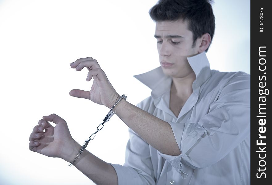 Young boy wrists with handcuffs. Young boy wrists with handcuffs