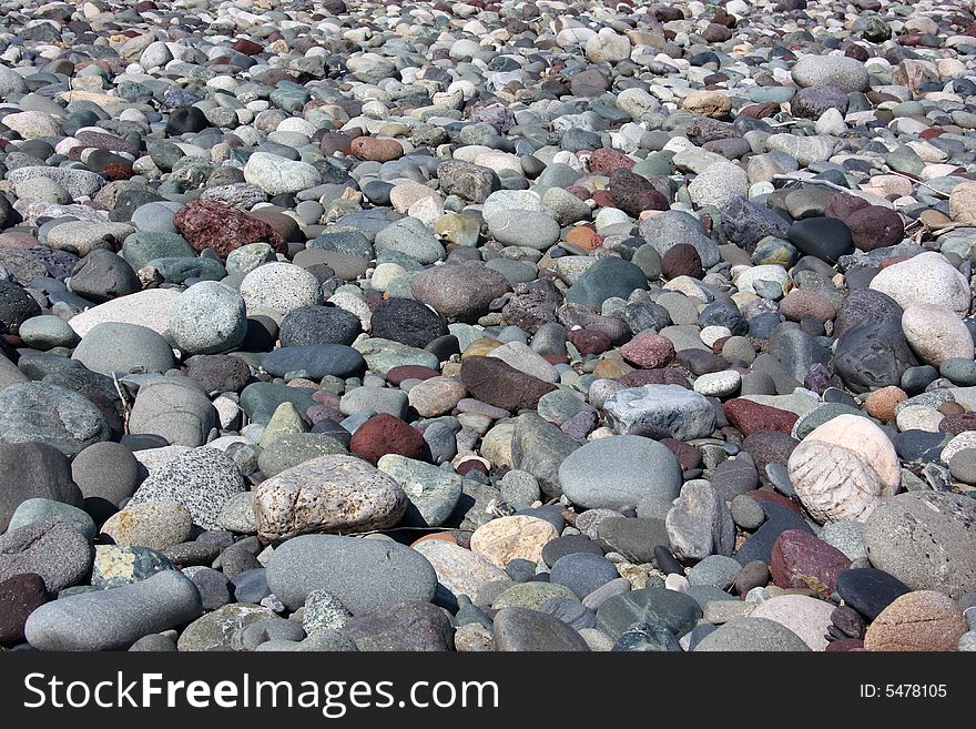 Rounded rocks and pebbles in riverbed. Rounded rocks and pebbles in riverbed