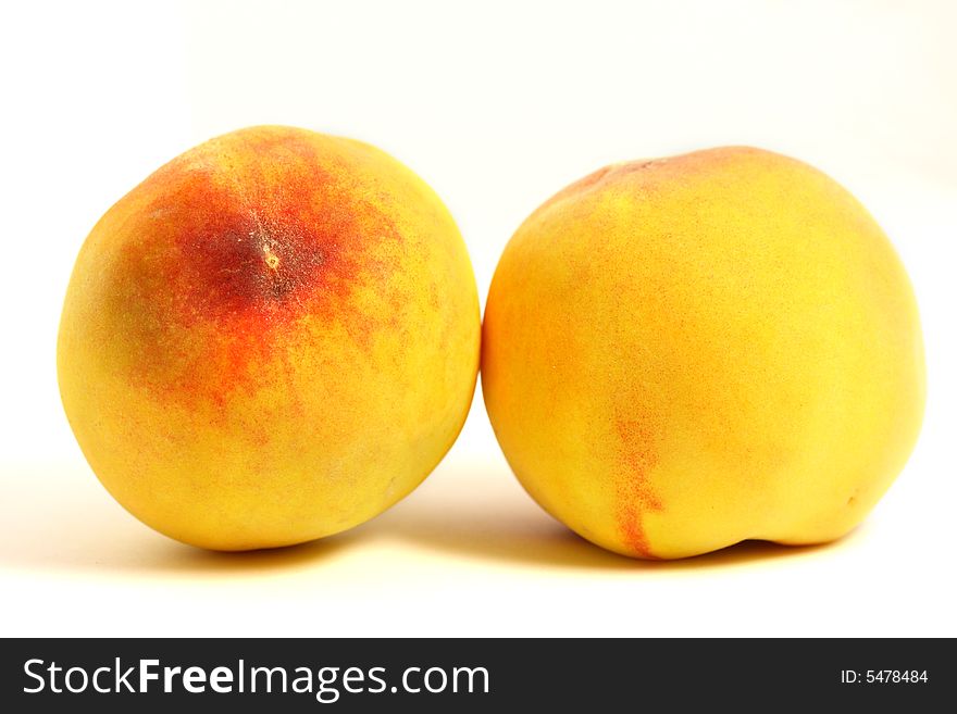Peaches on isolated white background.