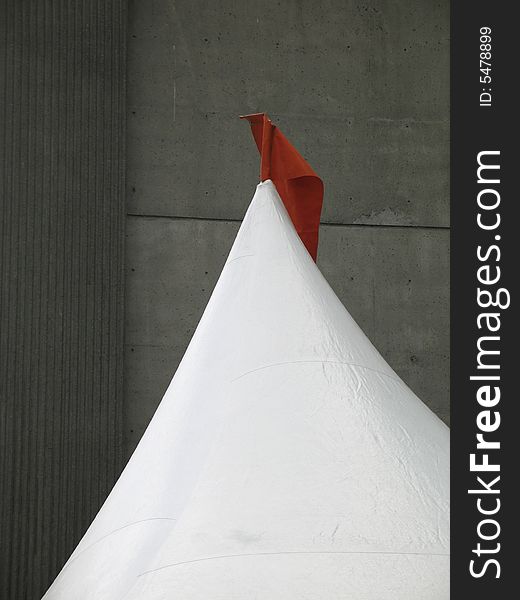 White tent with red flag