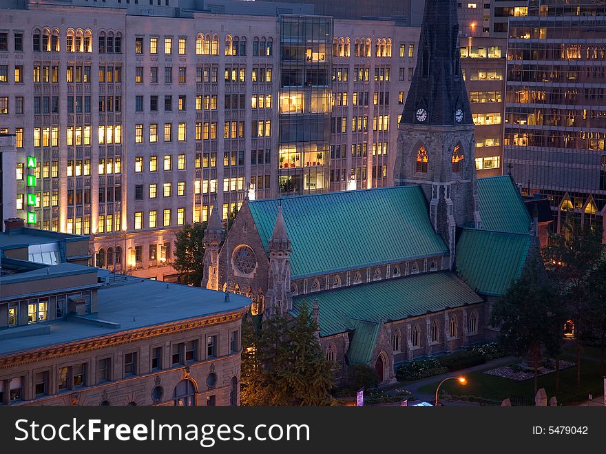 A church in the city at dusk. A church in the city at dusk