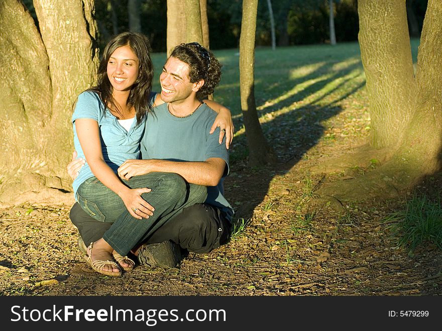 Couple Sitting Under a Shady Tree - Horizontal