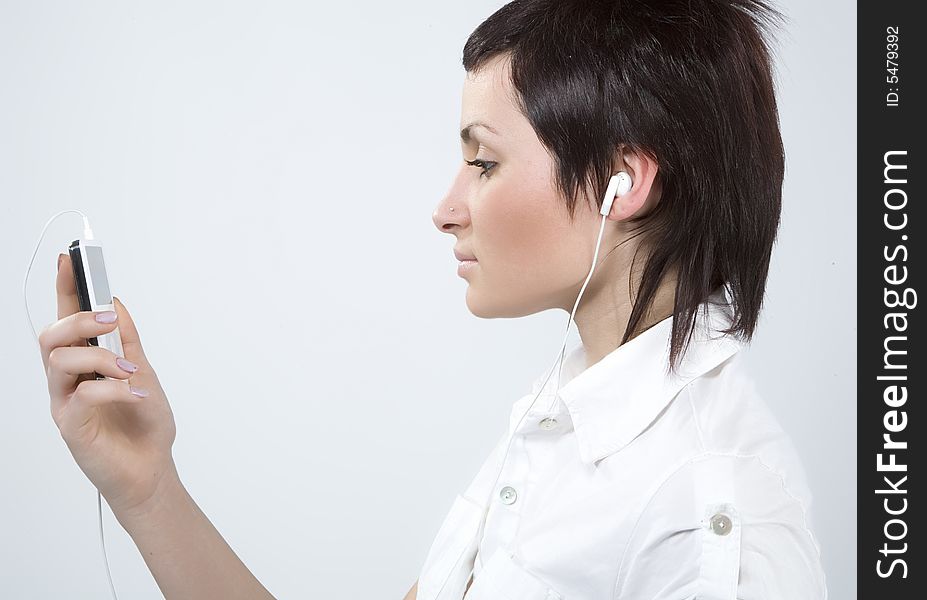 Girl with Mp3-player listening to the music