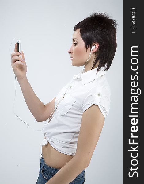 Girl with Mp3-player listening to the music