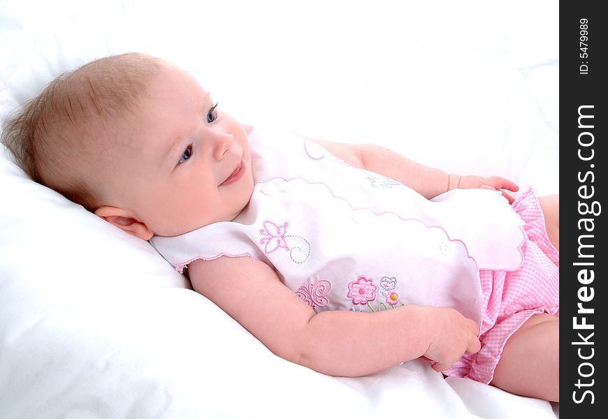 Baby girl lying on white blanket. Baby girl lying on white blanket