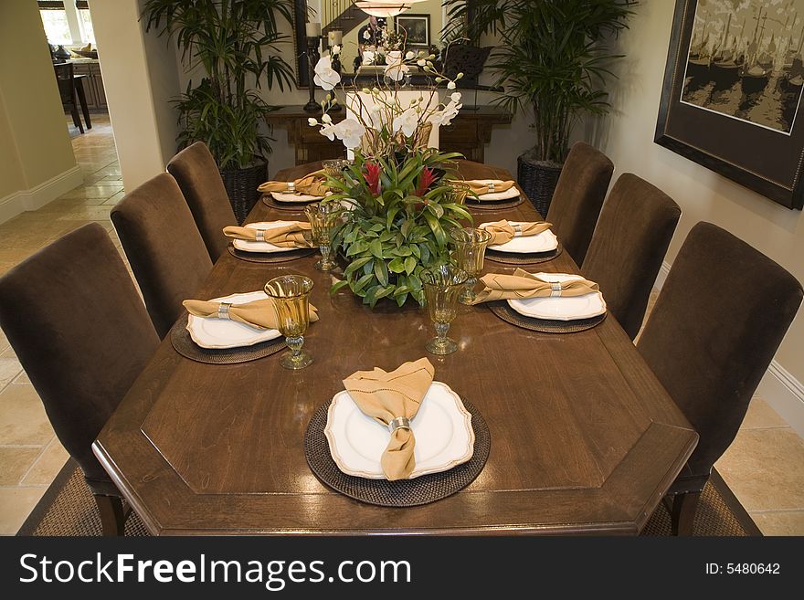 Luxury home dining table with exquisite tableware. Luxury home dining table with exquisite tableware.