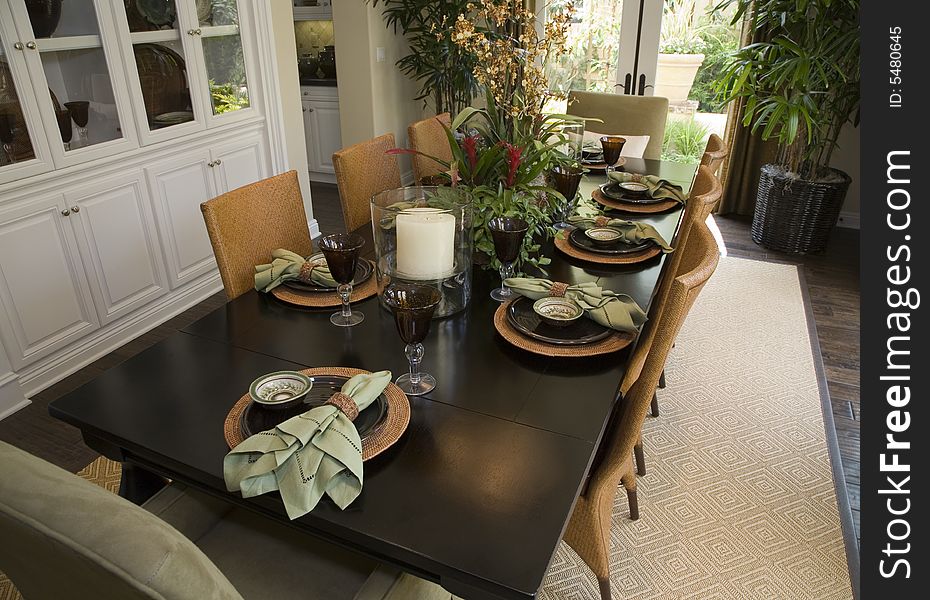 Luxury home dining table with modern tableware. Luxury home dining table with modern tableware.