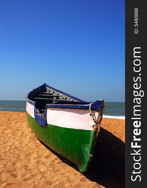 A fishing boat on the sea beach at Gujarat-India. A fishing boat on the sea beach at Gujarat-India.