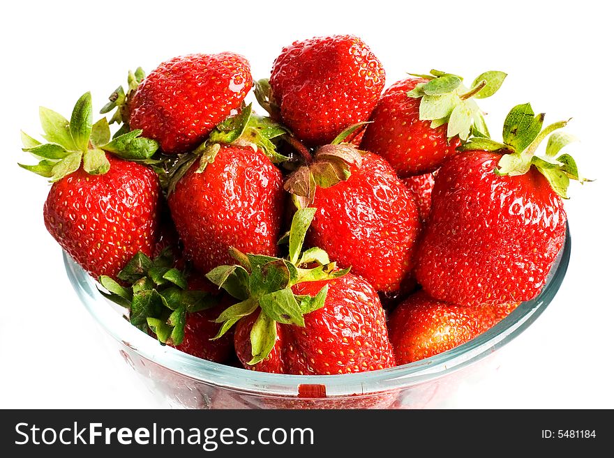 An image of glass cup with strawberries