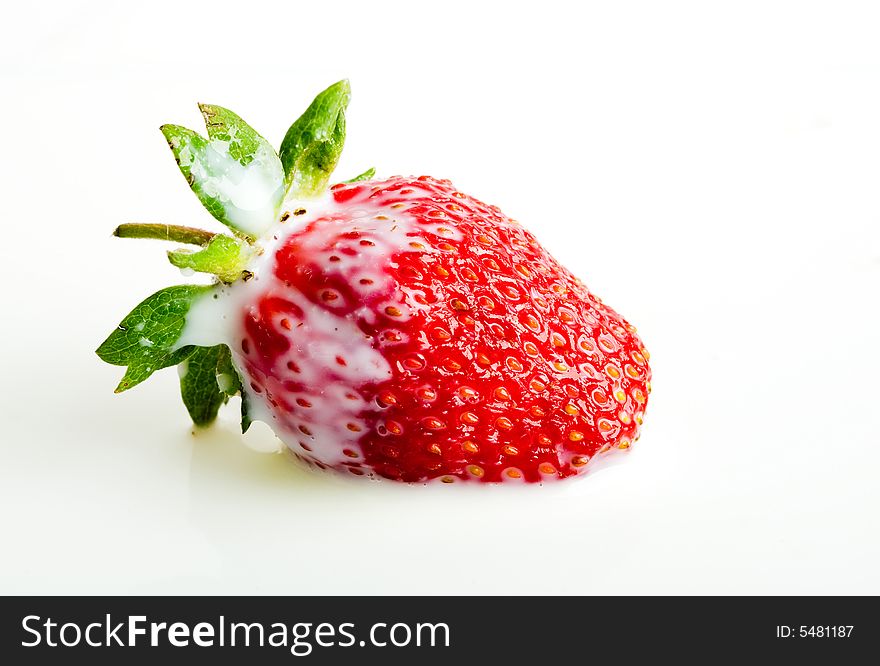 An image of strawberry in milk