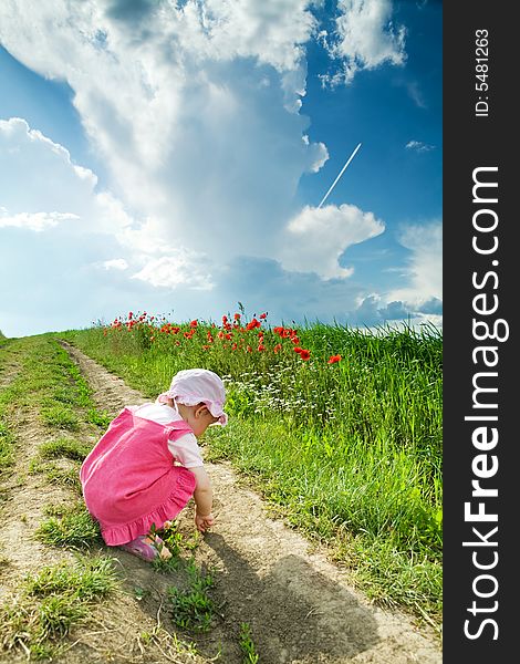 Child on the lane amongst green field. Child on the lane amongst green field