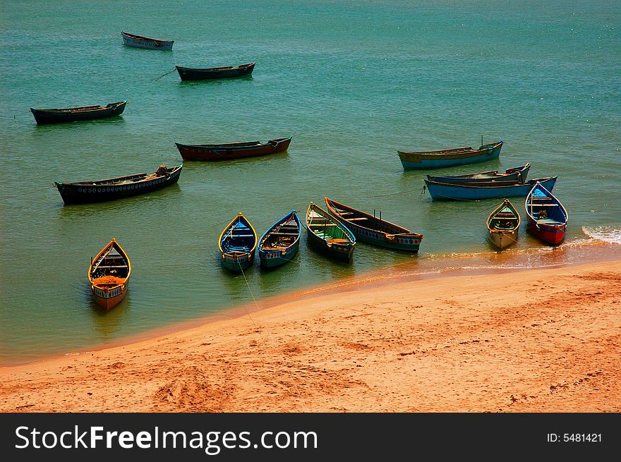 Fishing boats docked in sea. Fishing boats docked in sea.