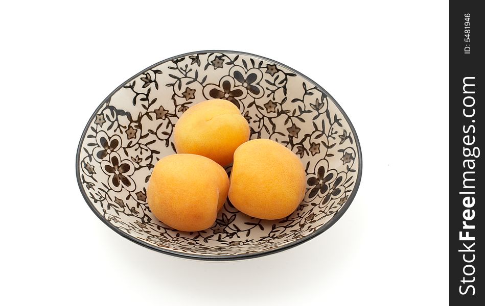 Three apricots isolated with path