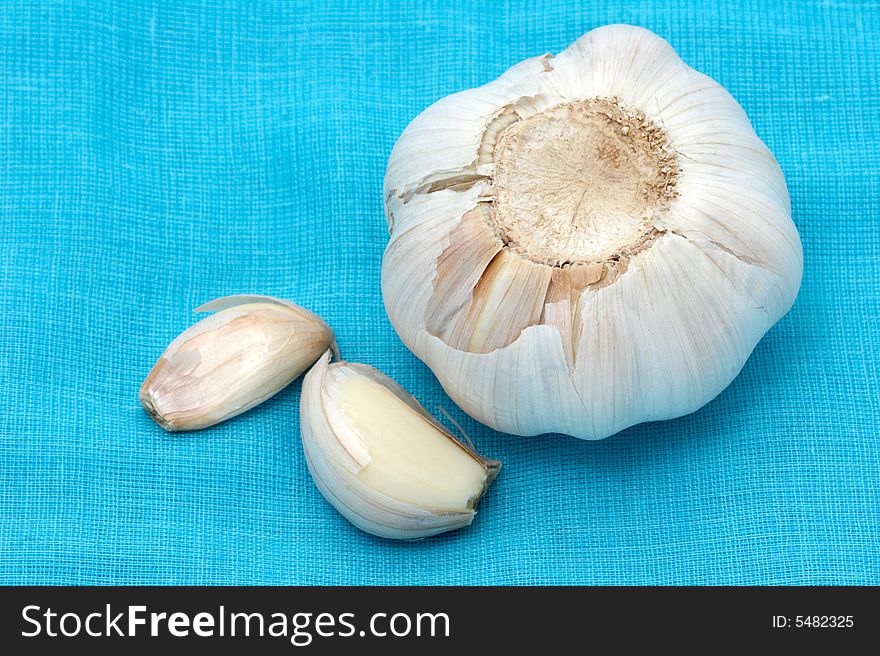 Garlic on a blue fabric