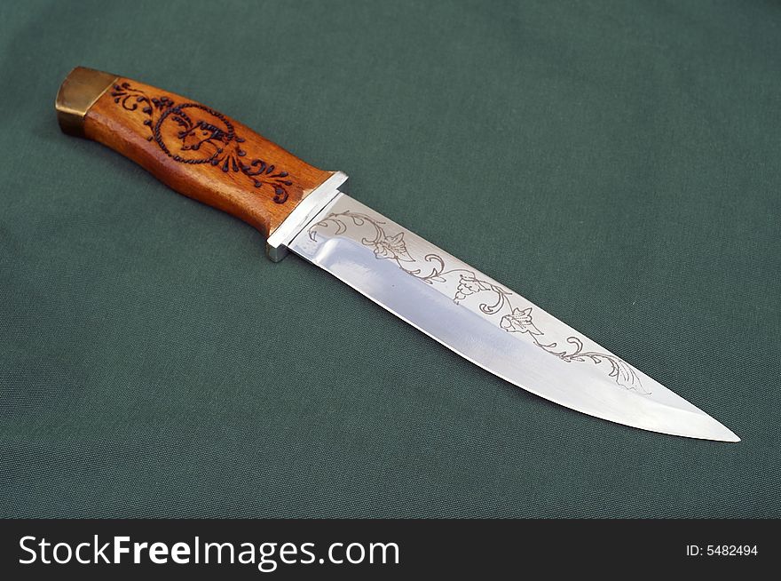 Handmade hunting knife with wooden handle. Handmade hunting knife with wooden handle