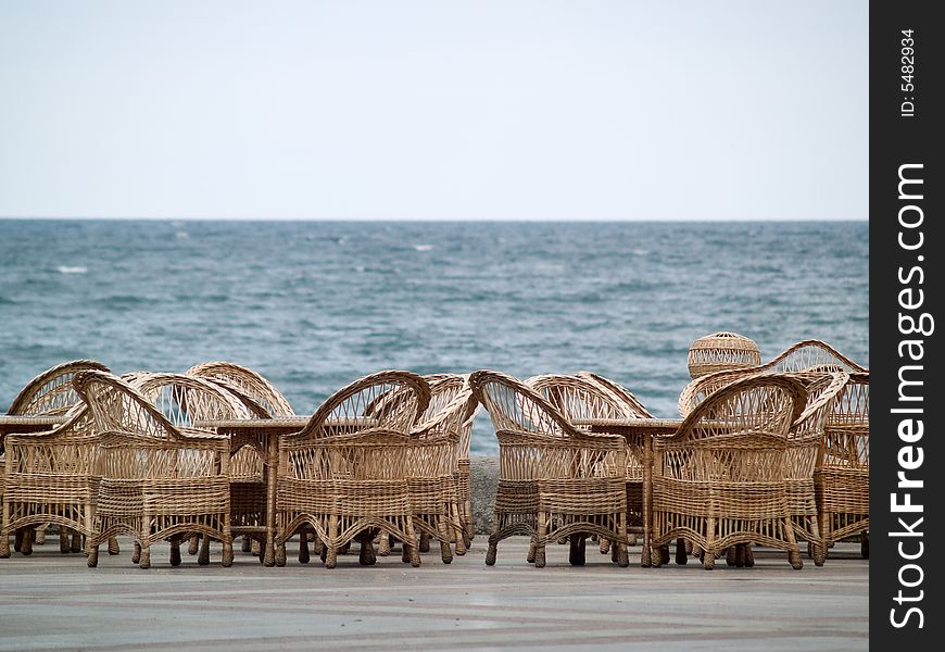 Rattan Chairs Bar Empty on Beach