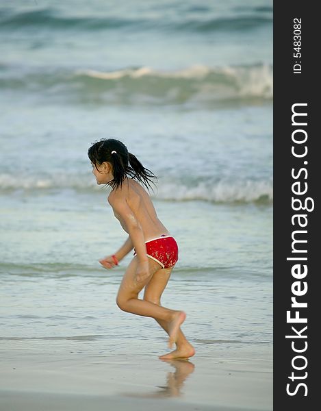Child walking in the sand on the beach. Child walking in the sand on the beach