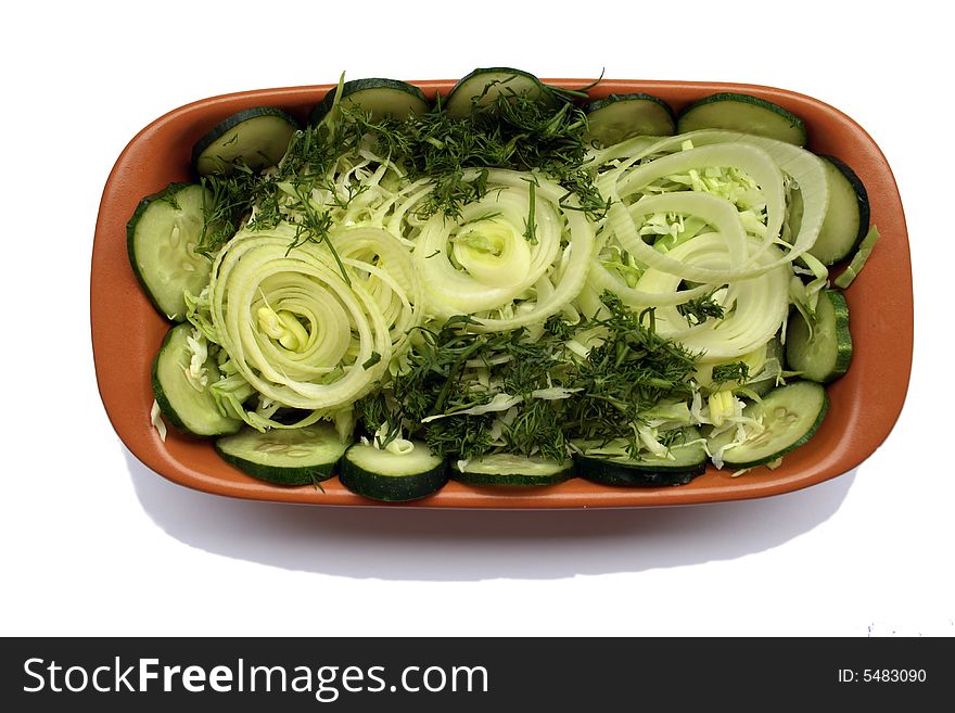 Isolated Vegetable Salad in brown ceramic cup