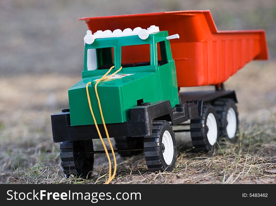 The toy lorry on a grass