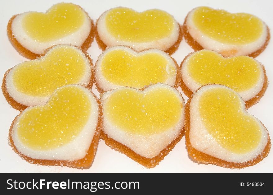Fruit candy in the form of hearts as a background. Fruit candy in the form of hearts as a background