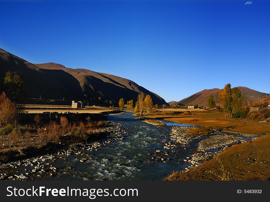 Small village with blue air under sunset,. Small village with blue air under sunset,