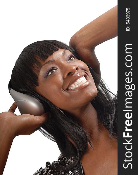 Beautiful young woman rocking out to music on her headphones. Beautiful young woman rocking out to music on her headphones