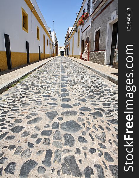 Lonely girl in the street of the small Spanish town of Jerez de la Frontera