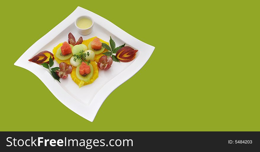 Nice healthful, fresh fruits composition on the beautiful plate, isolated. Nice healthful, fresh fruits composition on the beautiful plate, isolated