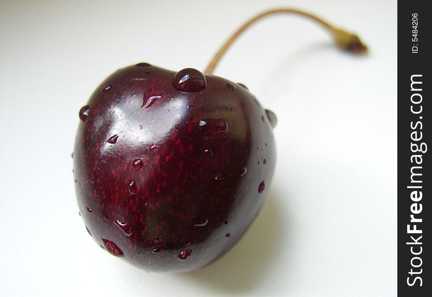 Sweet cherry close up on a gray-white background