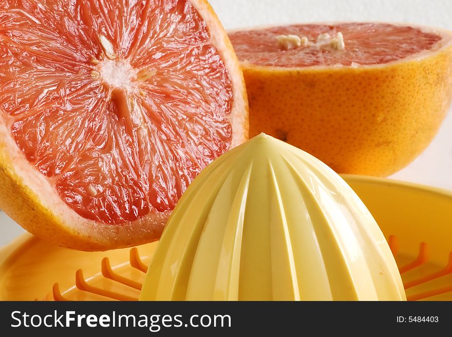 Grapefruit and squeezer with shallow depth of field