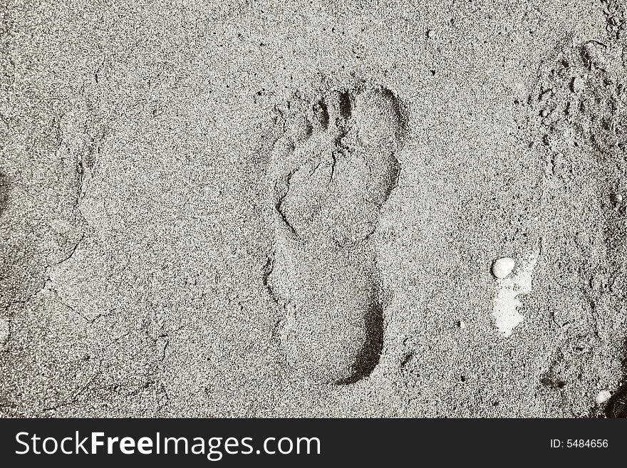 footprint on sand from foot of the person