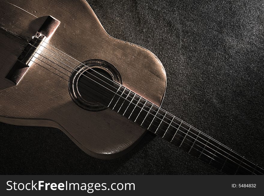 Still life with old acoustic guitar