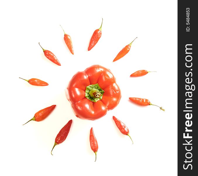 Arrangement of red peppers isolated over white