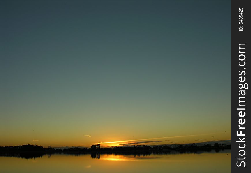 Sunset of a lake in Christchurch, New Zealand. Sunset of a lake in Christchurch, New Zealand