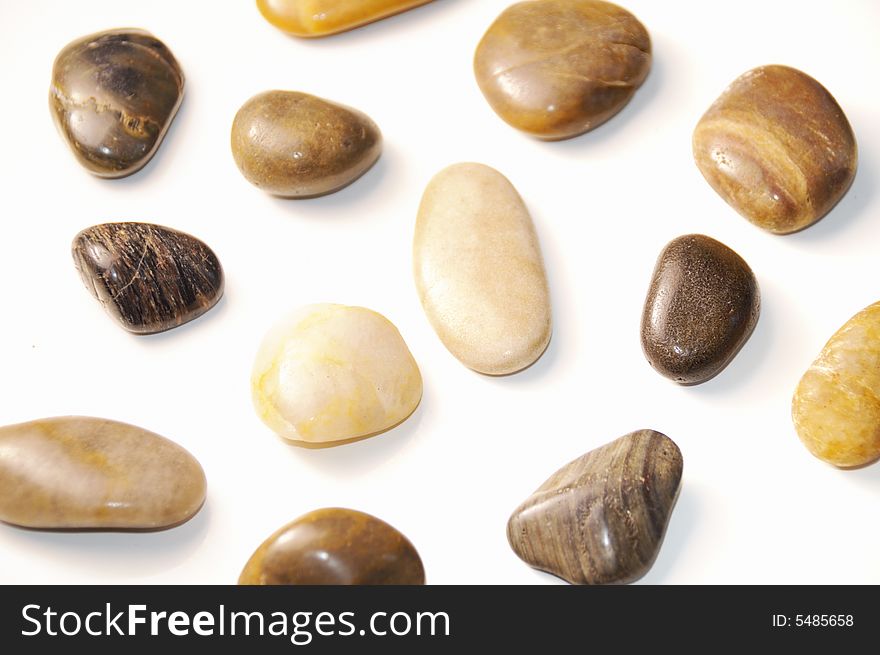 Assorted pebbles background isolated on white