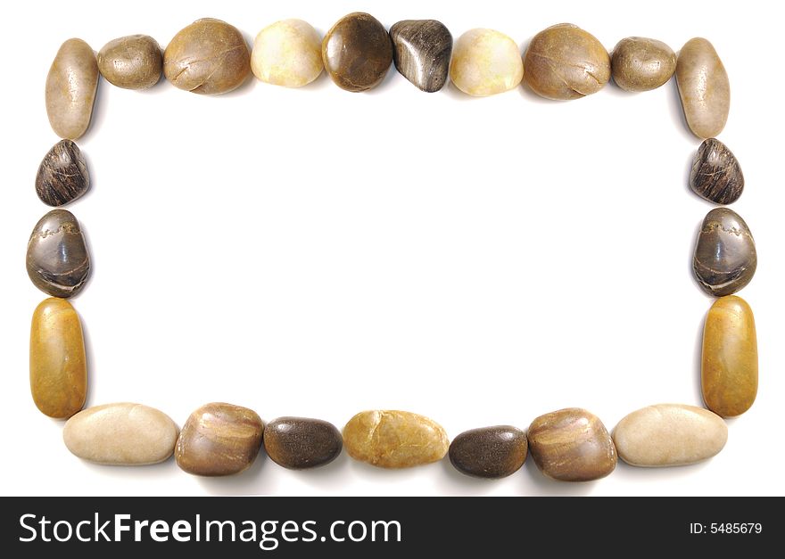 Assorted pebbles forming and border over white background. Assorted pebbles forming and border over white background